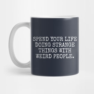 Spend your life doing strange things Mug